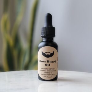 Black bottle of Boss Beard Oil.