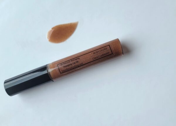 Brown lip gloss tube on white background.