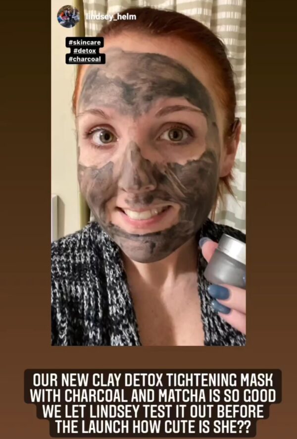 Woman with charcoal and matcha face mask.