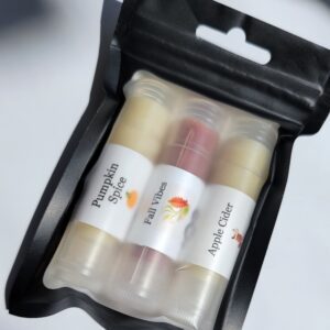 Three flavored lip balms in a bag.