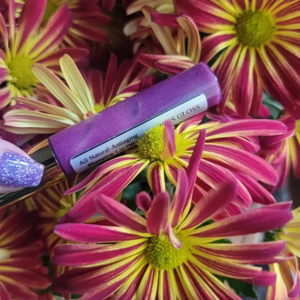 Purple lip gloss on pink flowers.