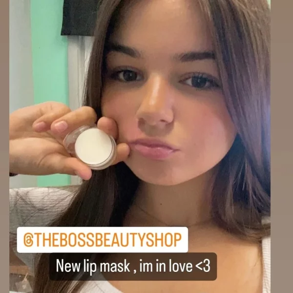 Woman holding new lip mask product.