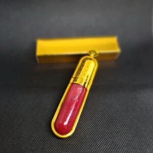 Gold lip gloss tube with red liquid.