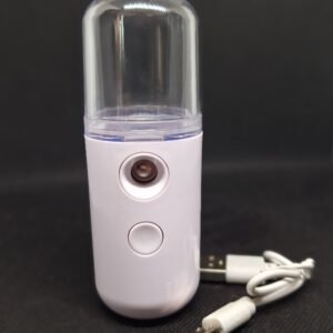 White portable facial mist sprayer with USB cable.