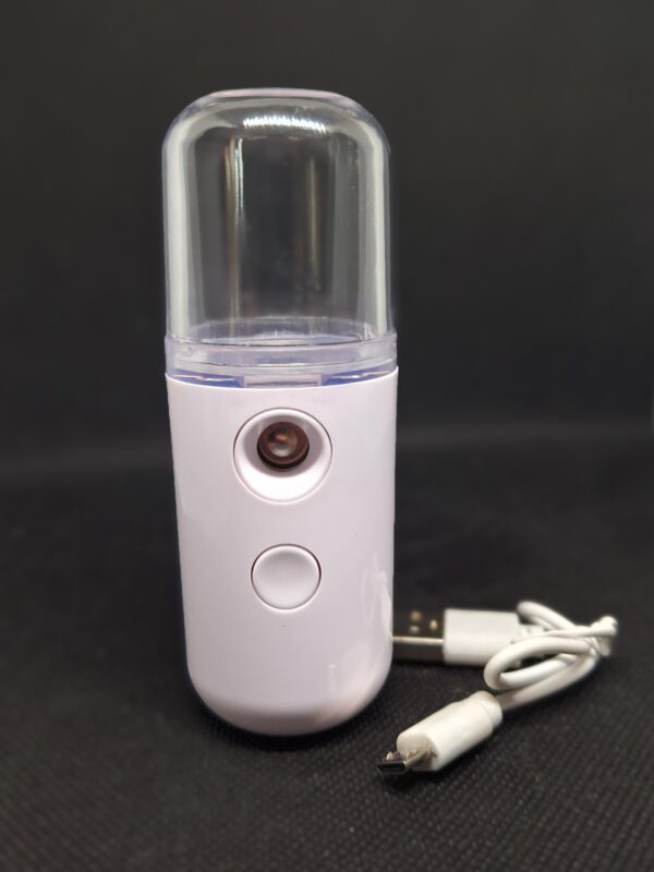 White portable facial mist sprayer with USB cable.