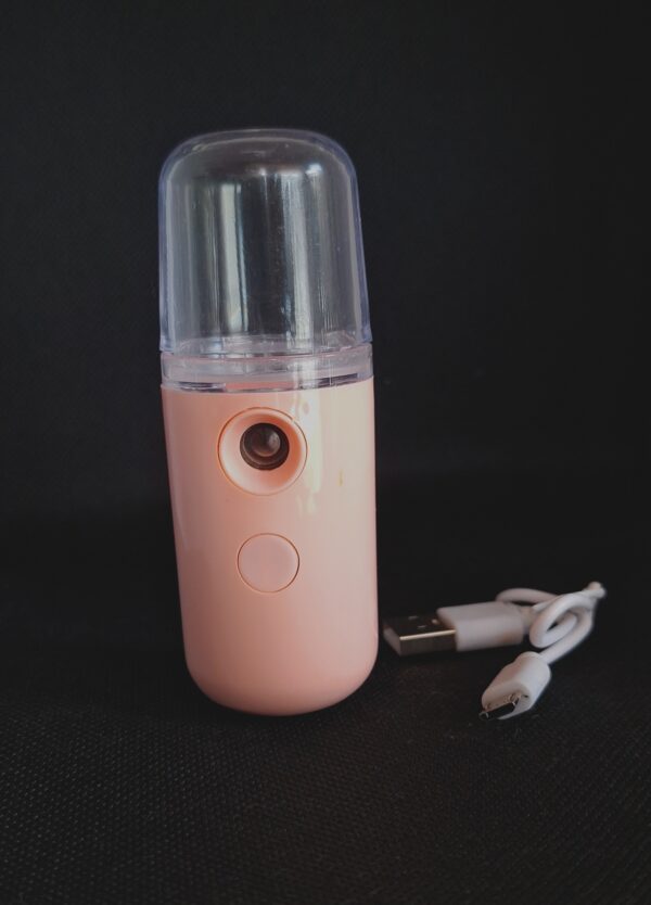 Pink portable facial mist sprayer.