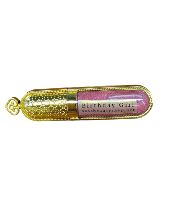 Gold lipstick tube with pink gloss.