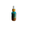 Teal and gold glass dropper bottle.