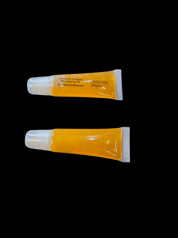 Pumpkin lip gloss tube, two views.