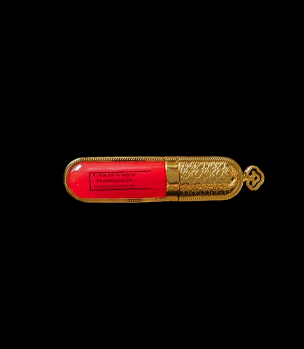 Gold and red lip plumping oil bottle.